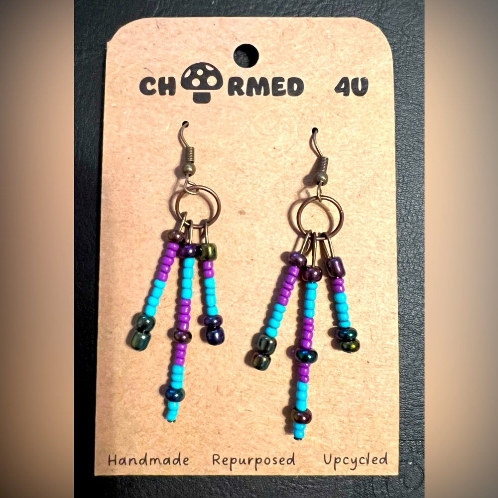 Purple and turquoise beads dangle earrings with bronze hardware